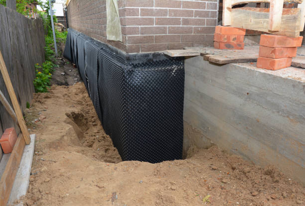 Happy homeowners after waterproofing job in Lanham